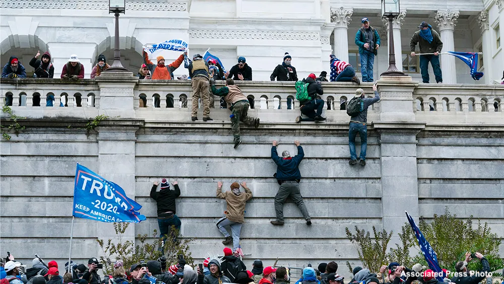 Associated Press photo of the Capital Hill protest in 2020 following Trump's loss to Biden in the US presidential election. MAGA hill billies are climbing a wall to storm the capitol building. It was a sad sack insurection. It had no chance, but signaled that a segment of people are more willing to ignore structures and rules of law when, say, they just don't get their way, not when they're in any real danger.